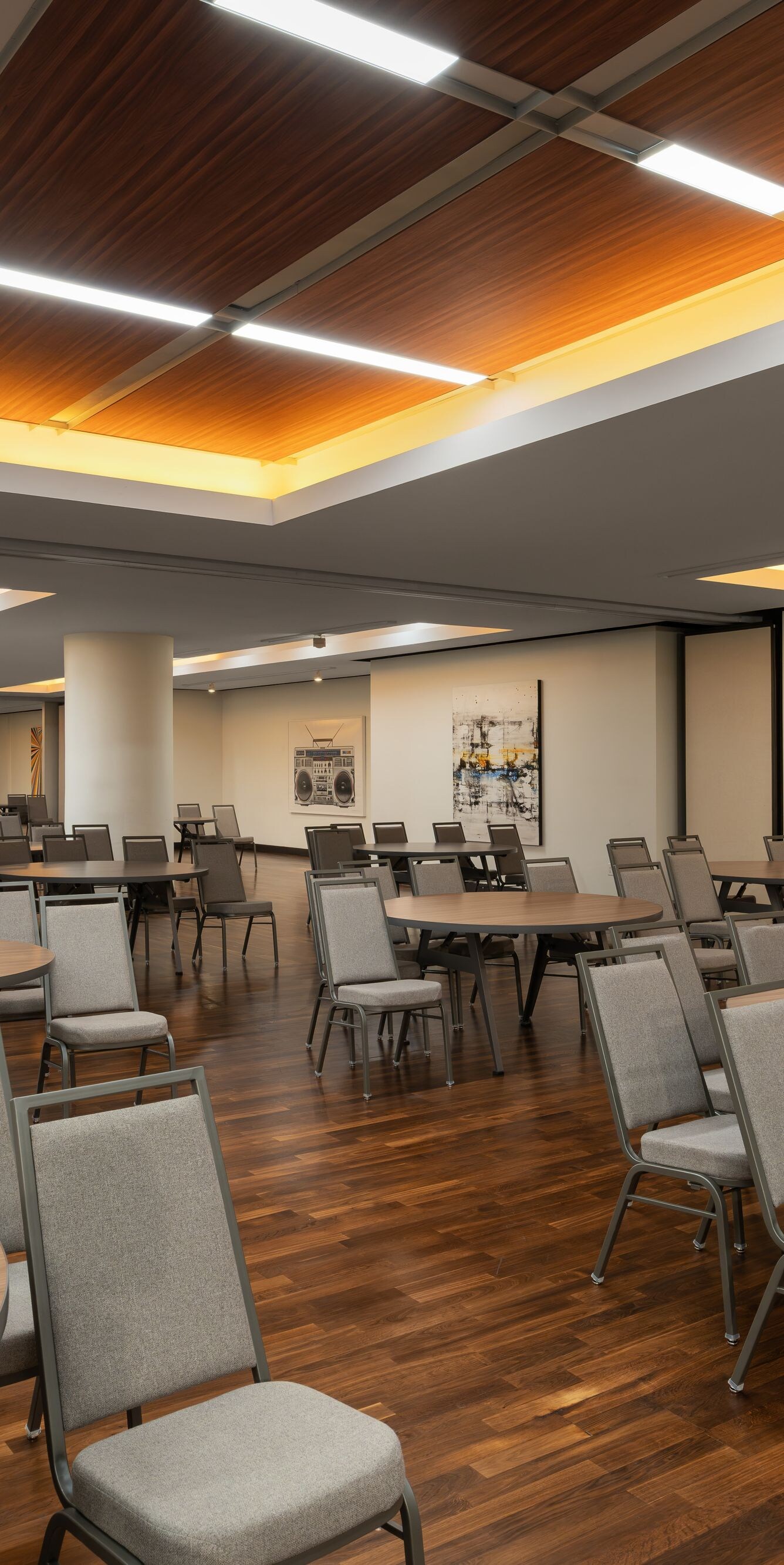 meeting room with round tables and wall art