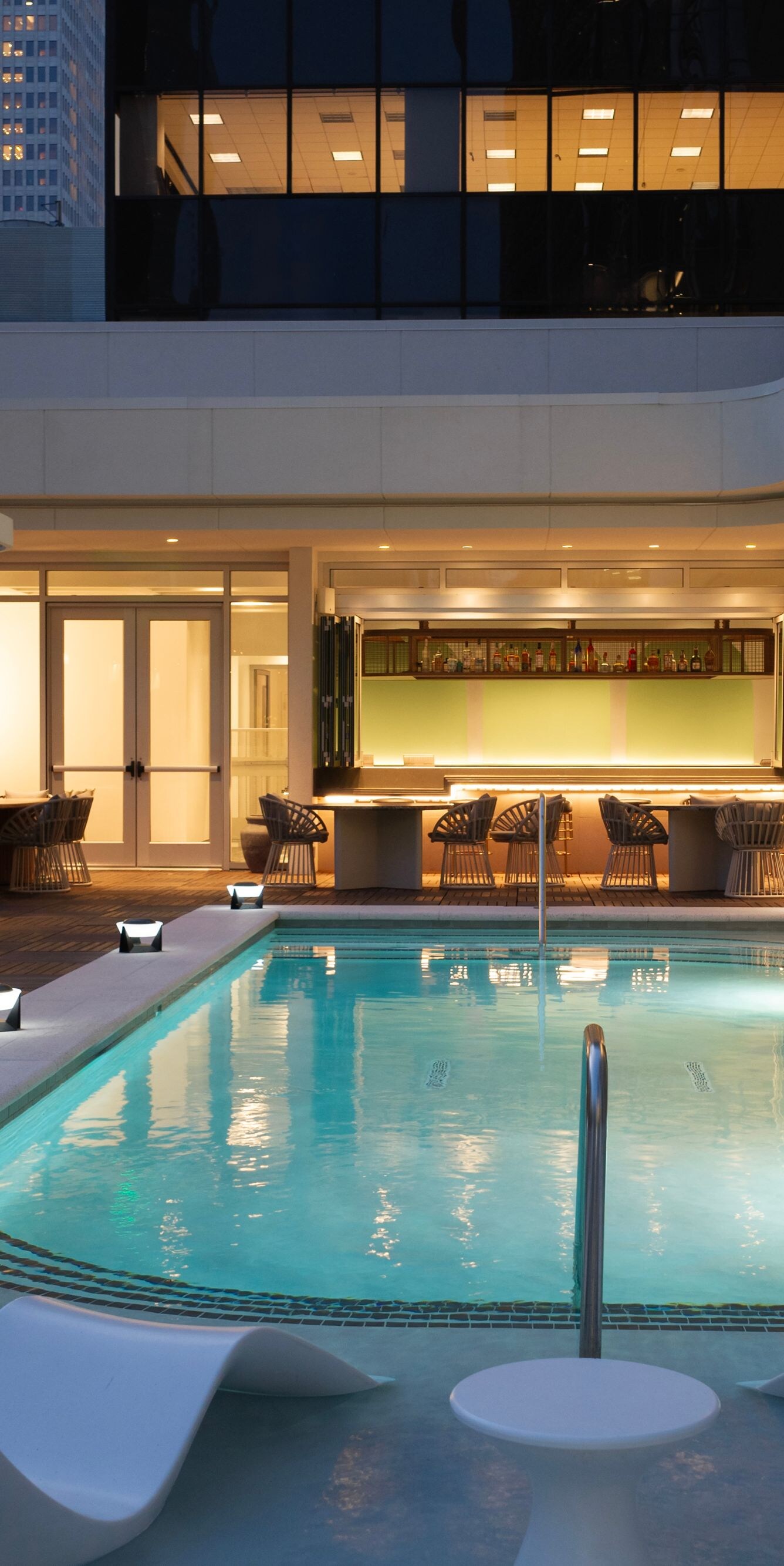 Rooftop pool with city views and bar