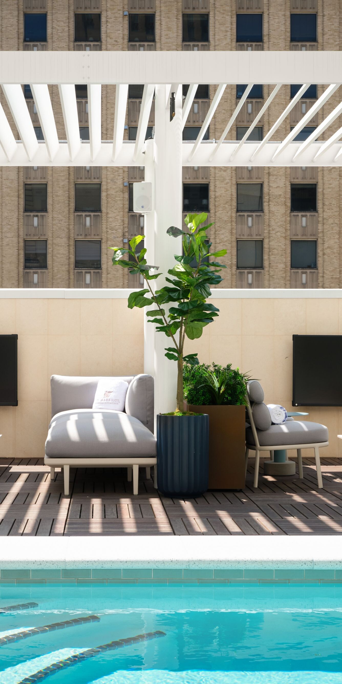 Rooftop pool with lounge and city views