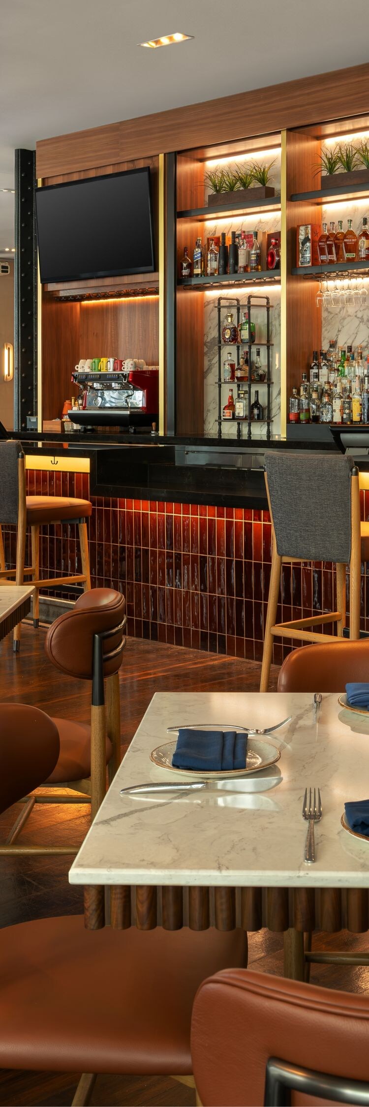 Modern restaurant with marble bar and plants
