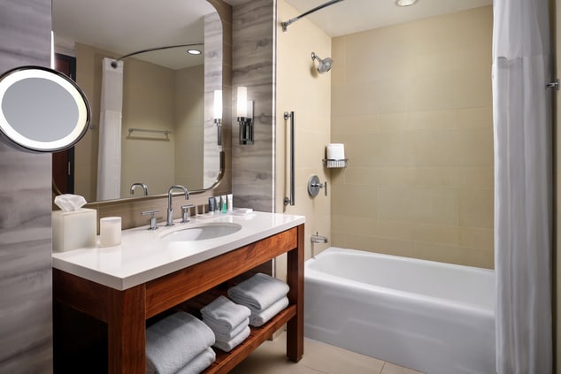 guest room bathroom, shower, sink, mirror