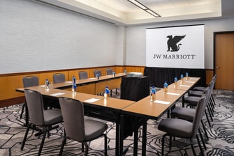 meeting room table and chairs with JW logo