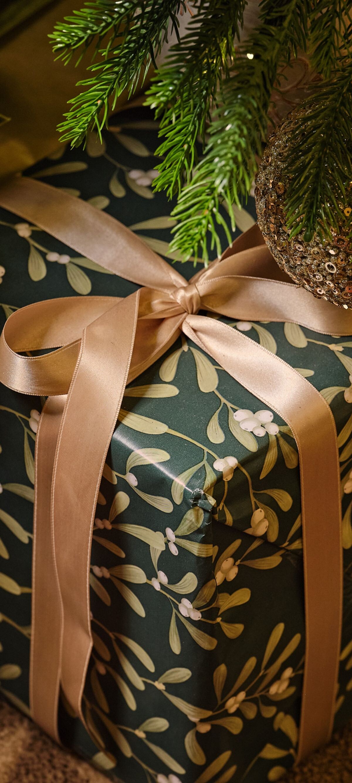 Christmas gift under tree.