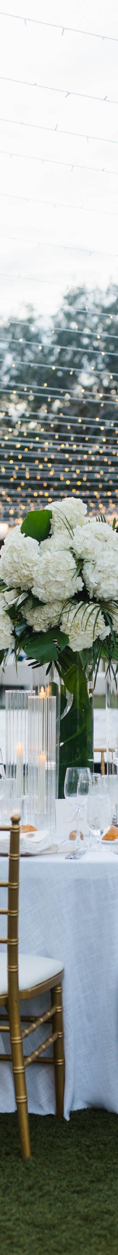 Outdoor reception tables beside water