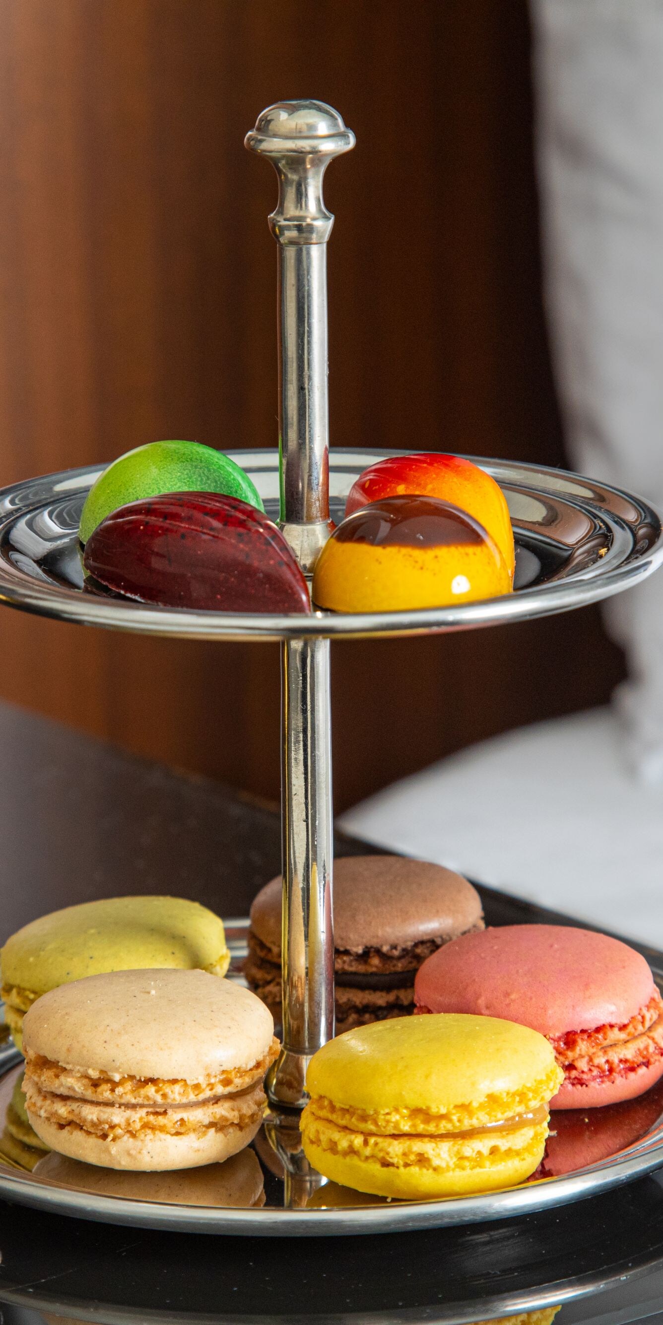 Artisanal macarons and chocolates on tray