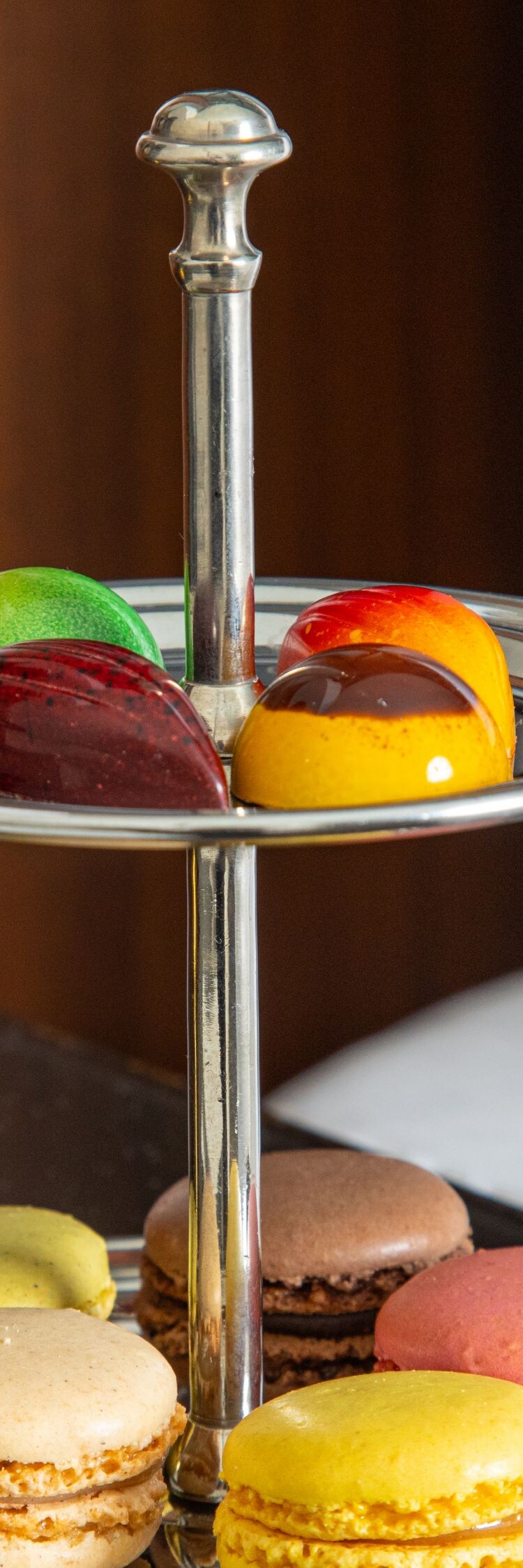 Artisanal macarons and chocolates on tray