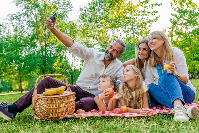 family enjoying a picnic in the park