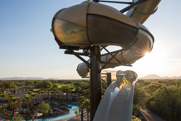 Tube water slides with sunrise in background
