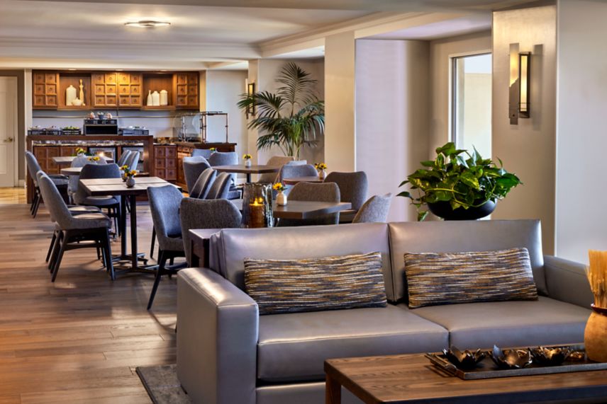 Couch and dining tables in JW Griffin Club