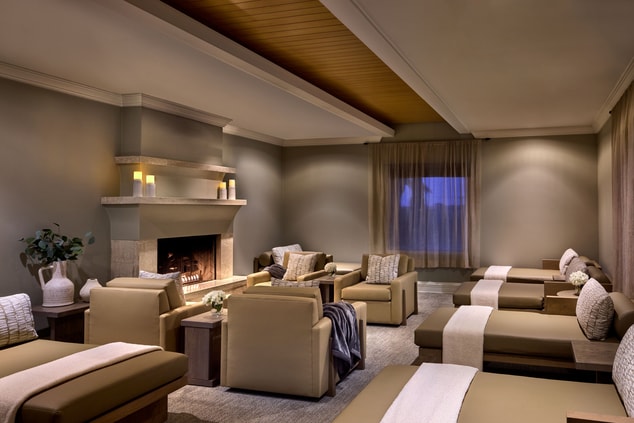 Lounge sofas and chairs surrounding fireplace