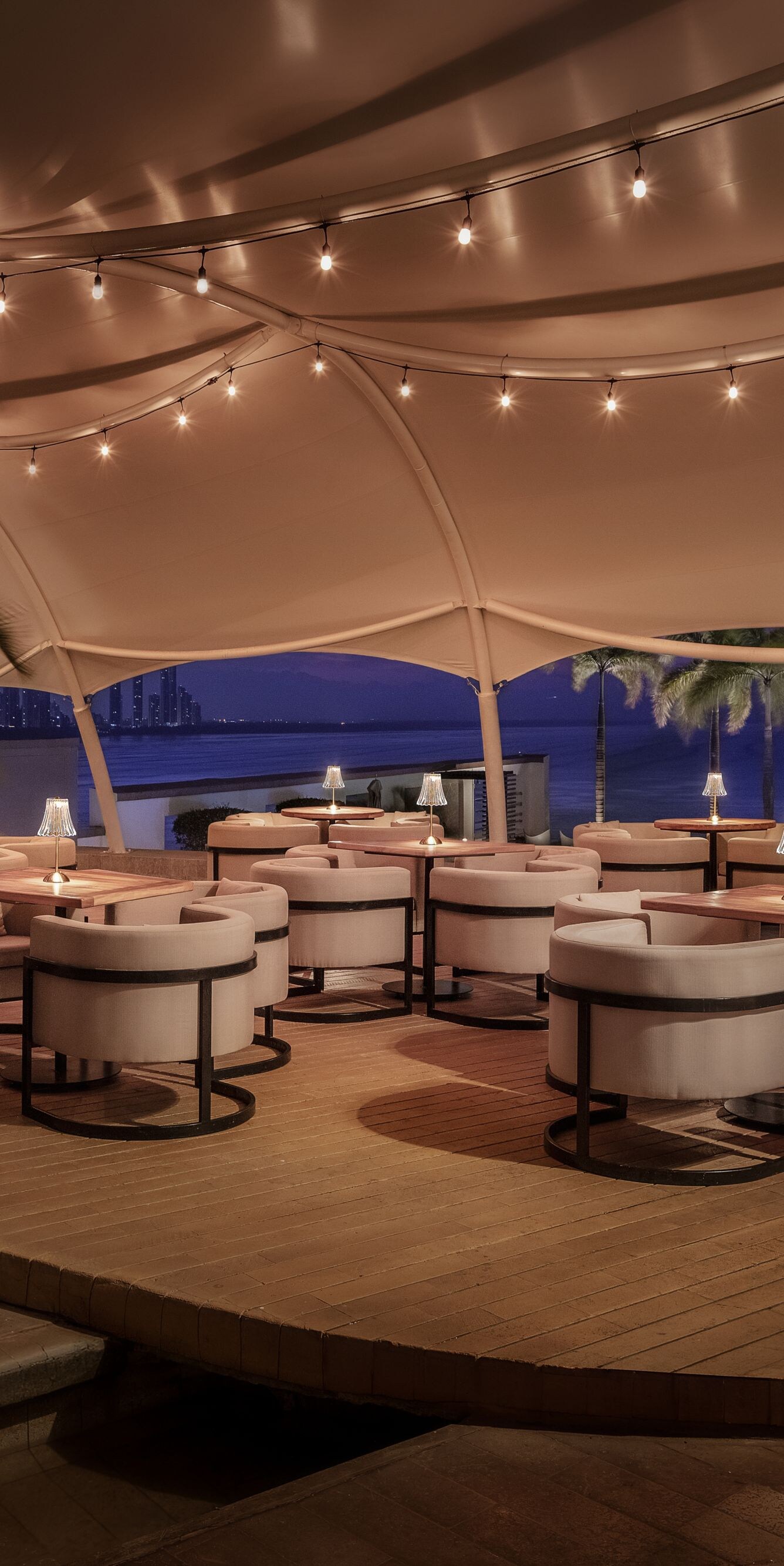 Outdoor terrace with seating and sea views