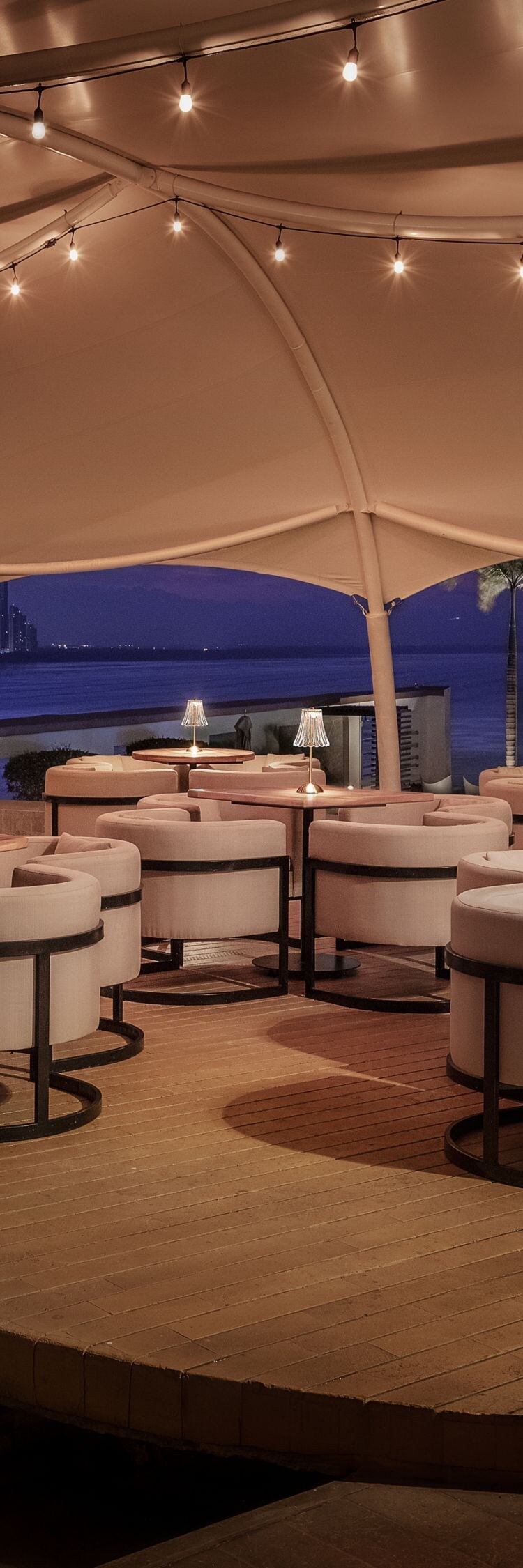 Outdoor terrace with seating and sea views