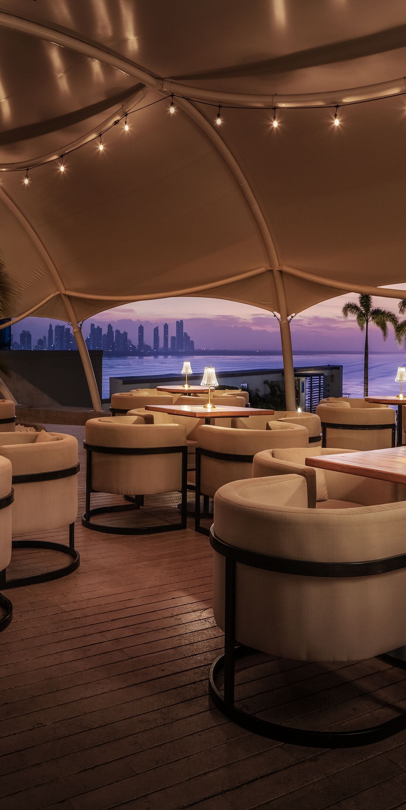 Rooftop bar with skyline view and seating