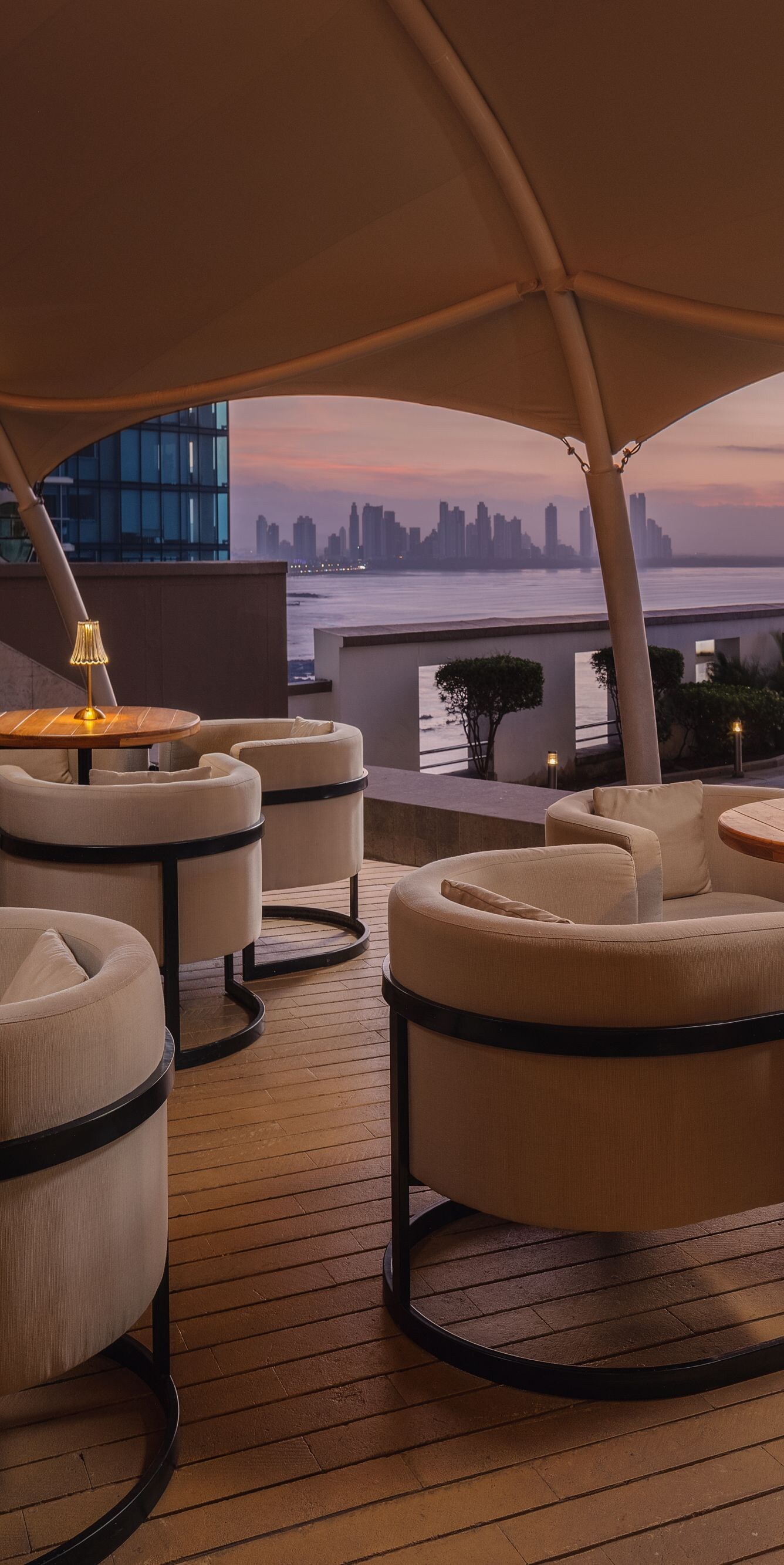 Rooftop bar with skyline view and pool