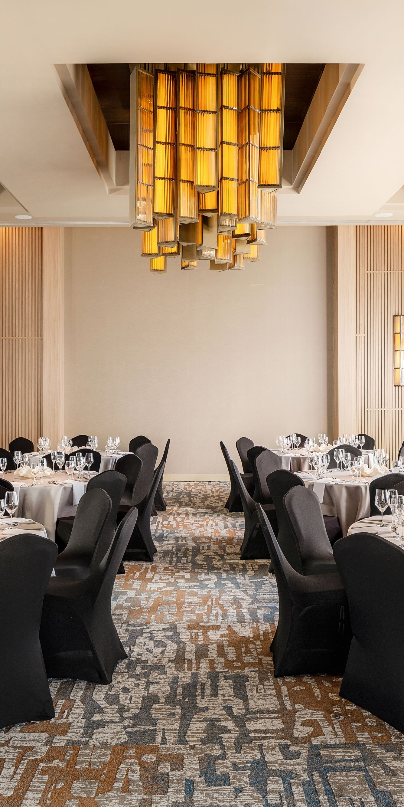 Meeting room set with round tables.