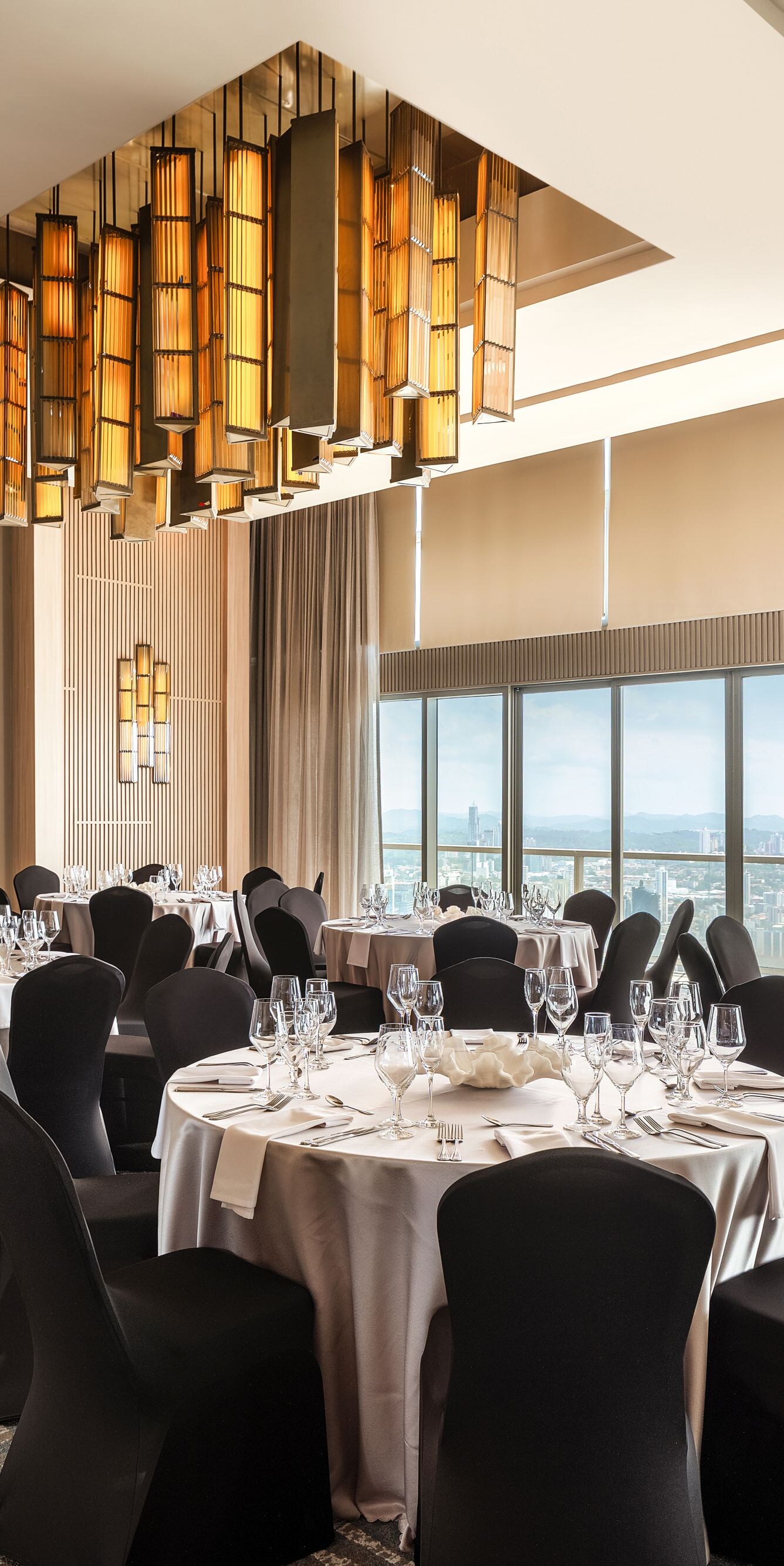 Meeting room set with round tables.