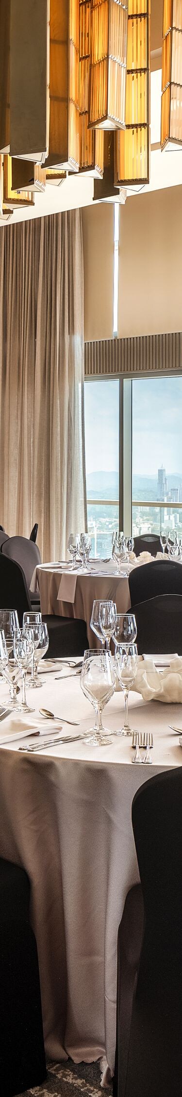 Meeting room set with round tables.