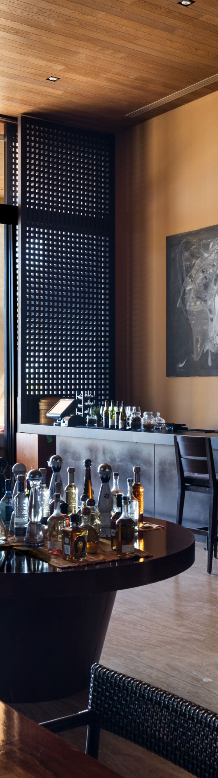 Modern bar with ocean view and seating 