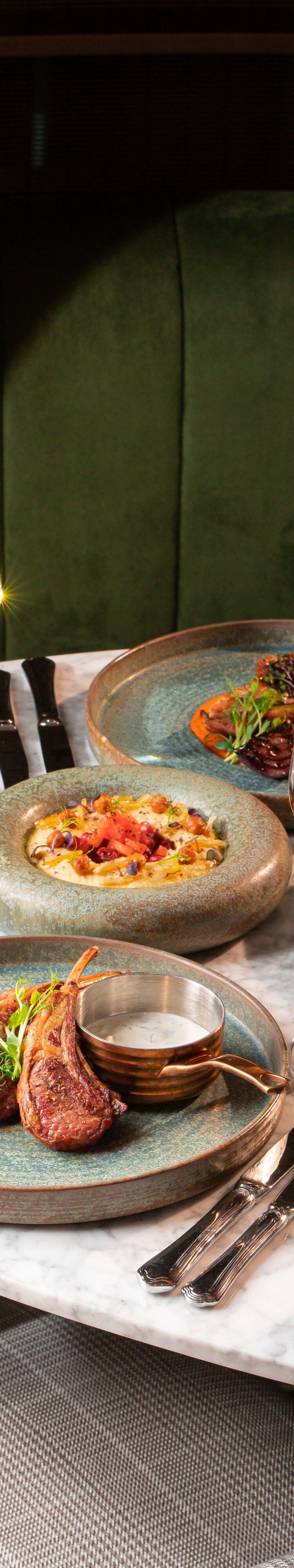 Lamb chops, prawns, mezze, salads, and dips served