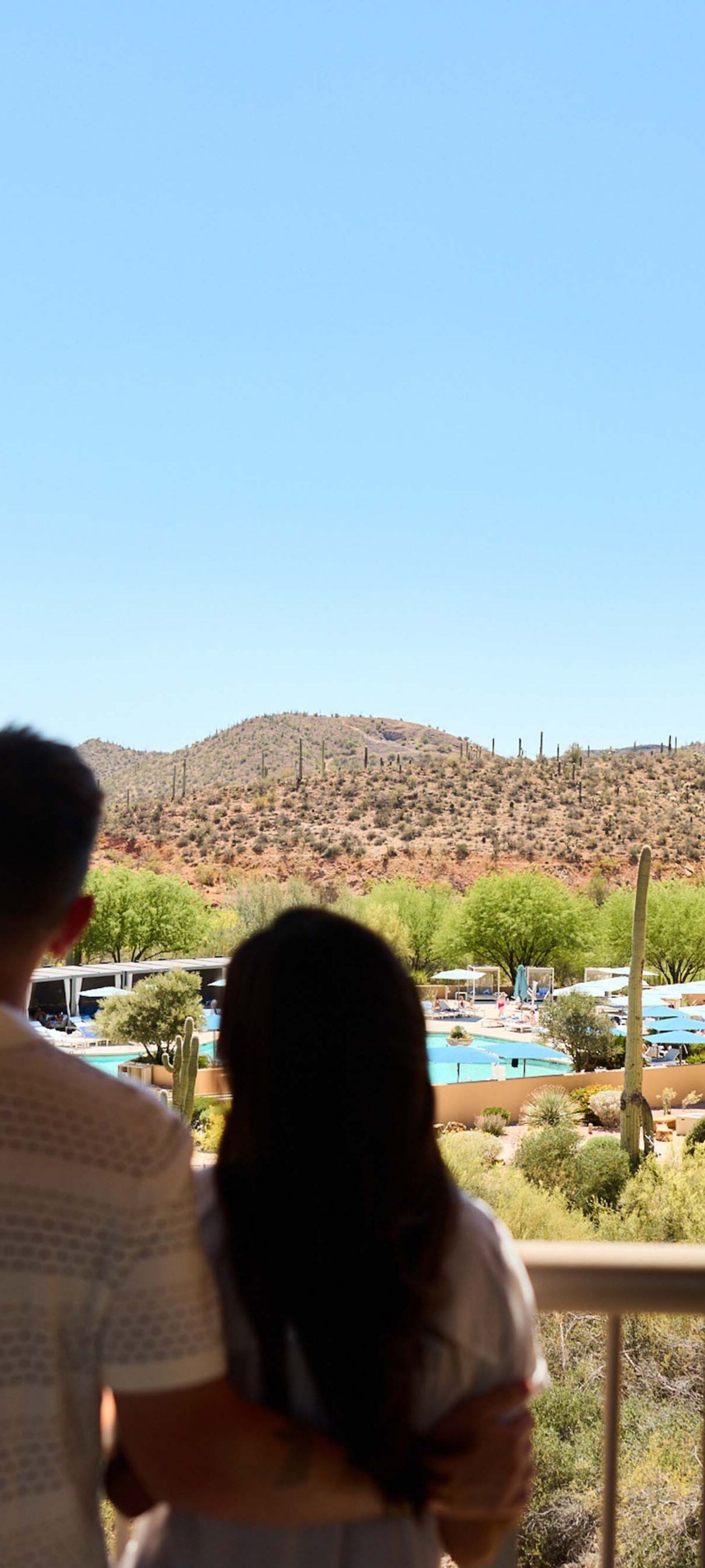 Couple viewing desert landscape