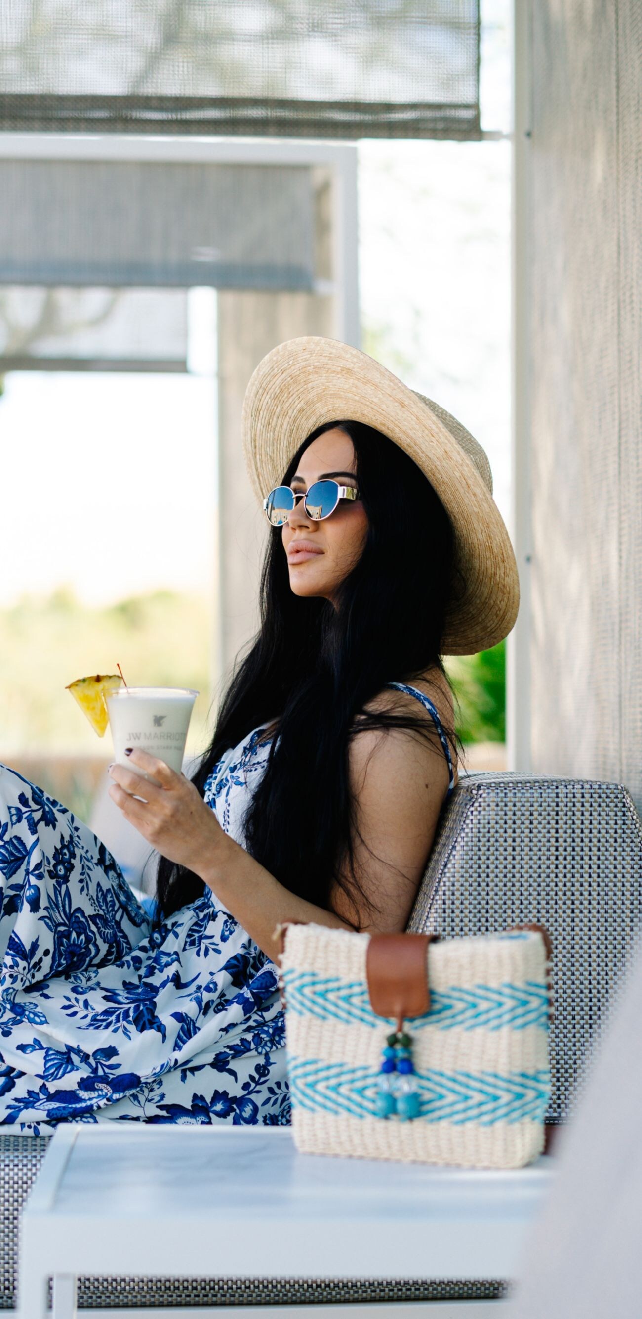 Woman relaxing by the pool