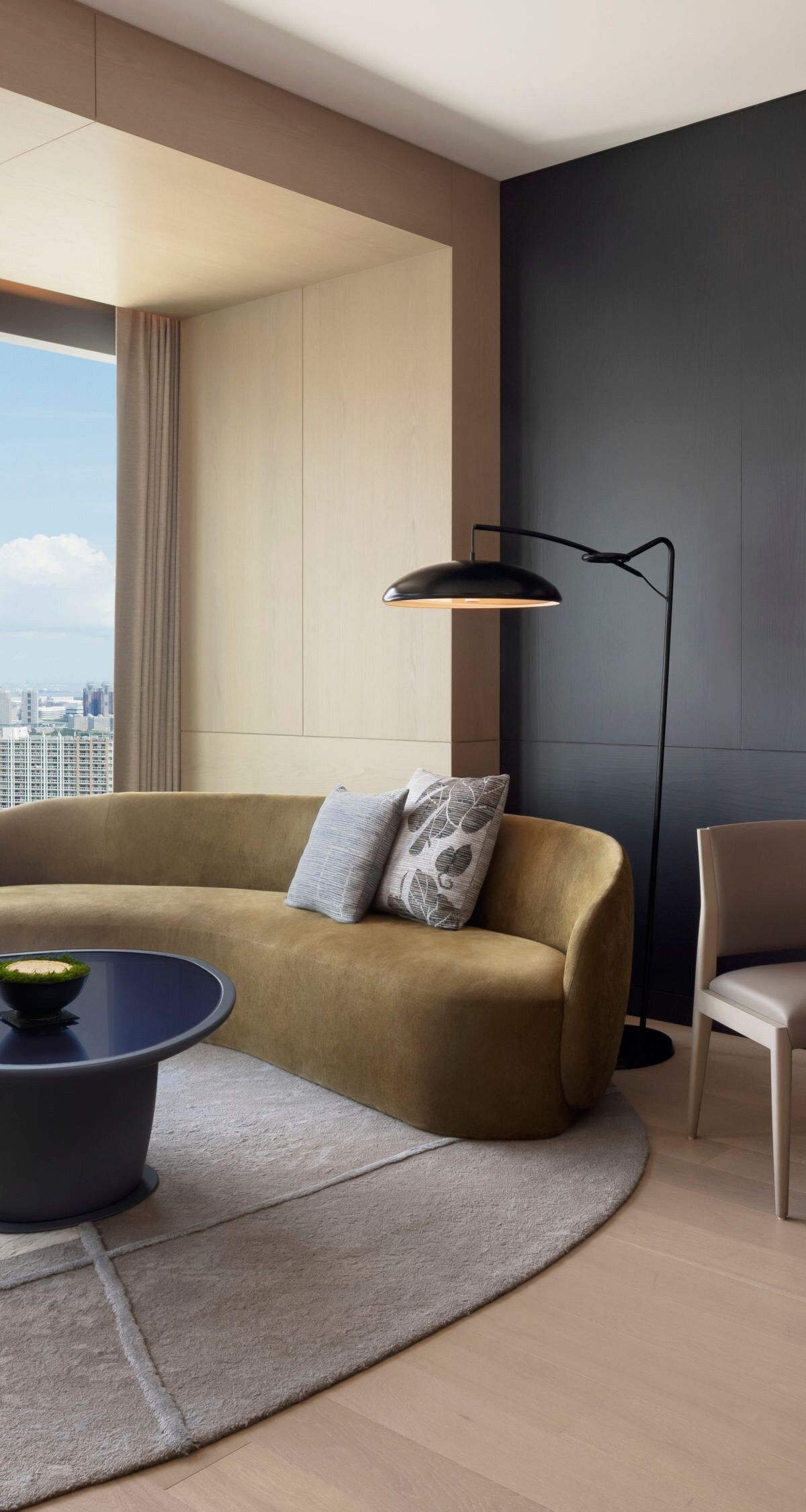 Suite living area with city skyline view