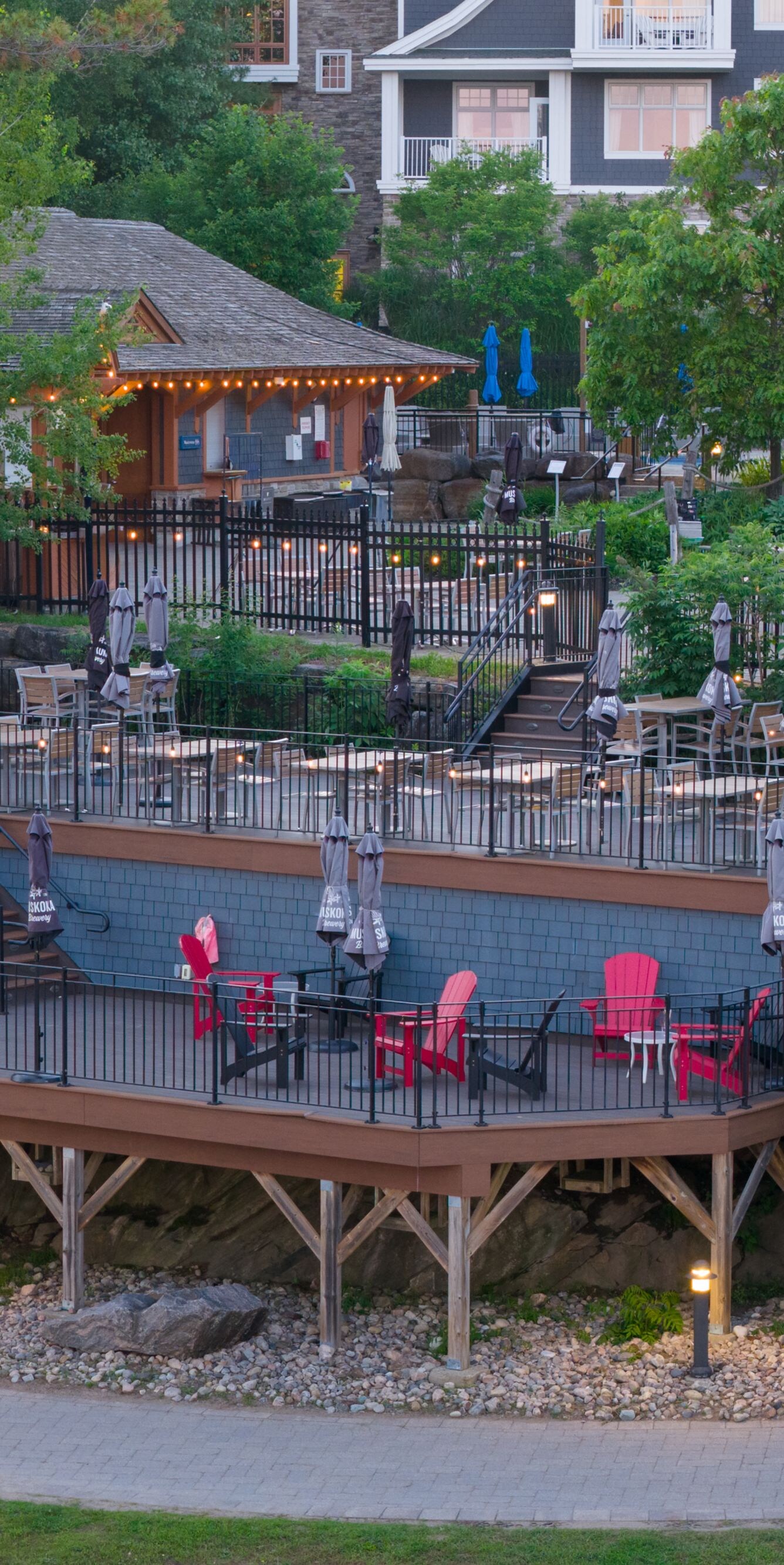Multi-level outdoor terrace with red chairs