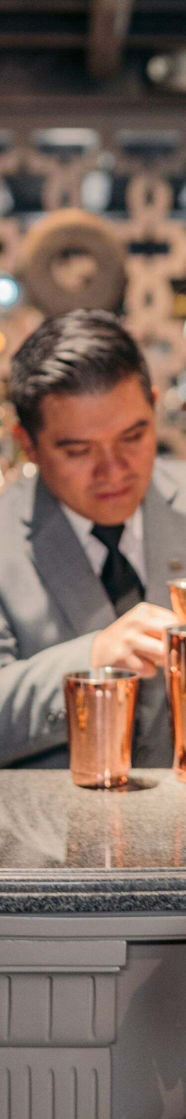 Couple getting cocktails at bar
