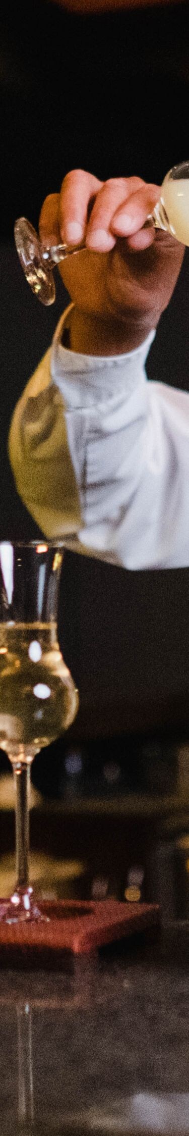 Bartender preparing a Pisco Sour.