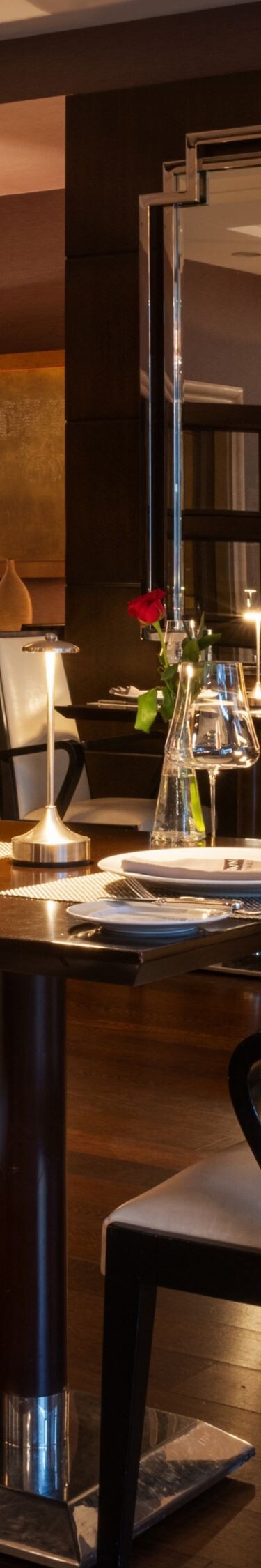 Aruni Restaurant dining area with set tables