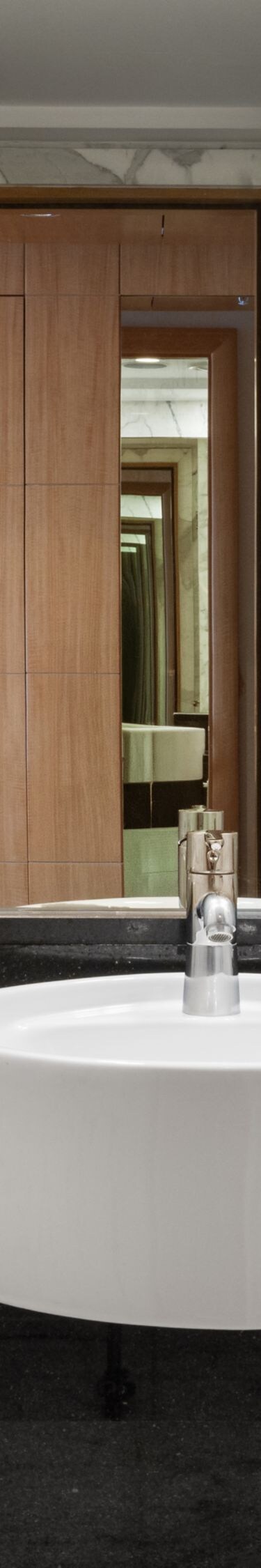 Marble bathroom vanity with illuminated mirror