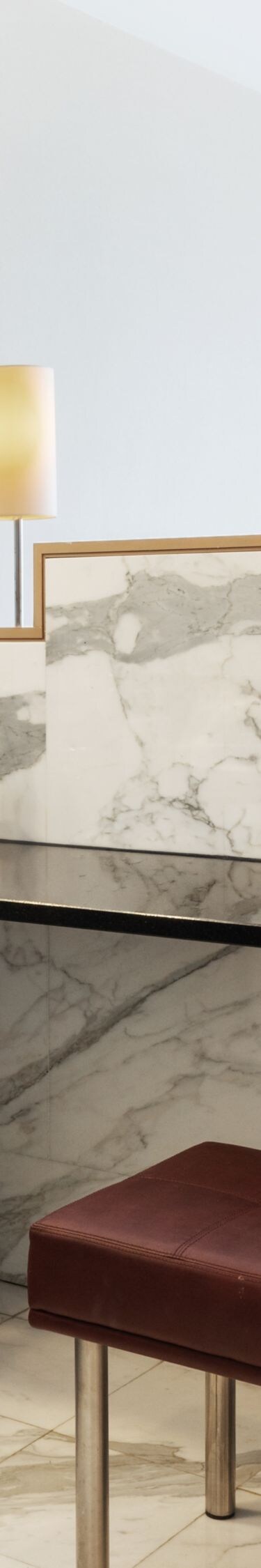 Marble bathroom with vanity and large mirrors