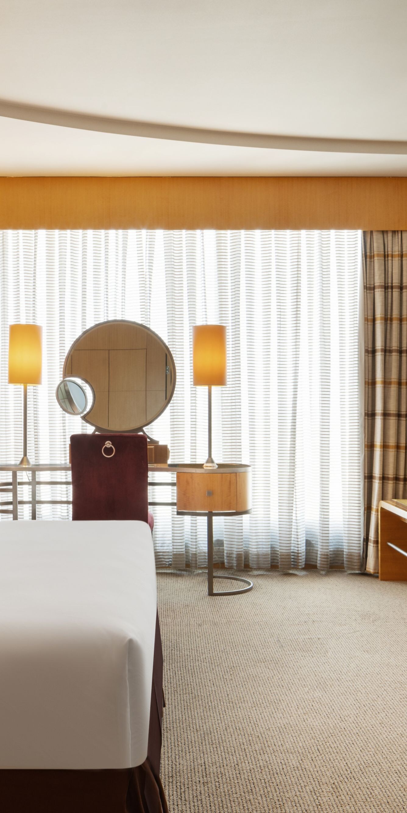 Spacious junior suite with king bed and vanity