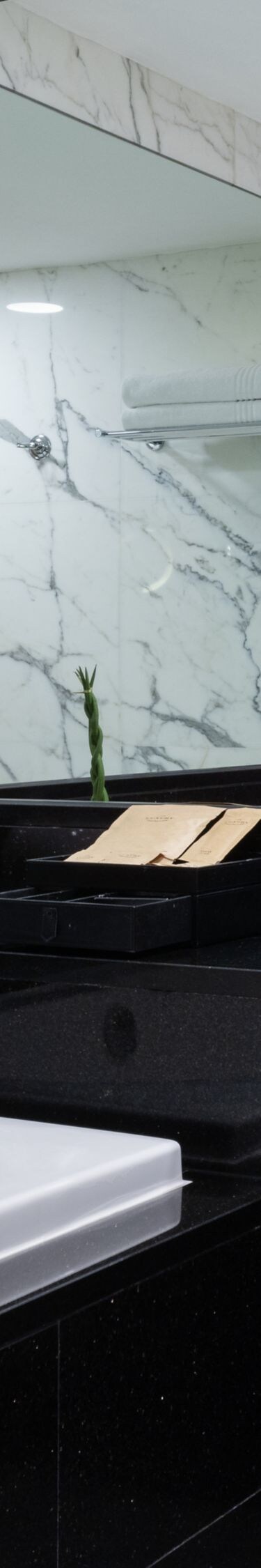 Marble bathroom with bathtub and vanity