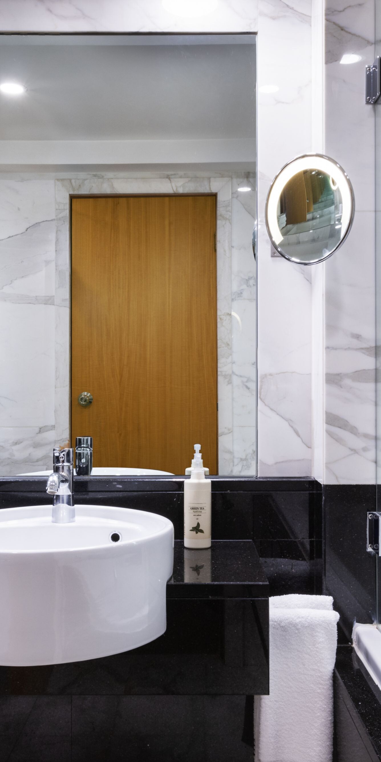Marble bathroom with bathtub and shower