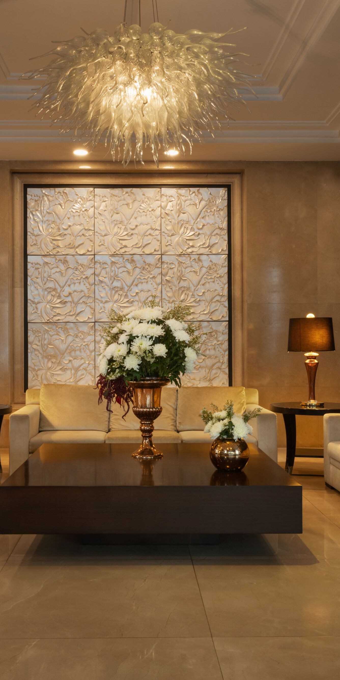 Lobby seating with sofas and floral display