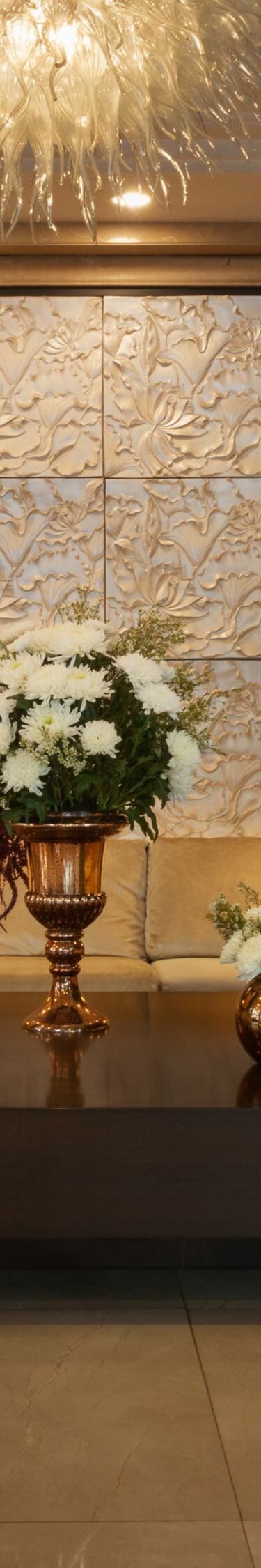 Lobby seating with sofas and floral display