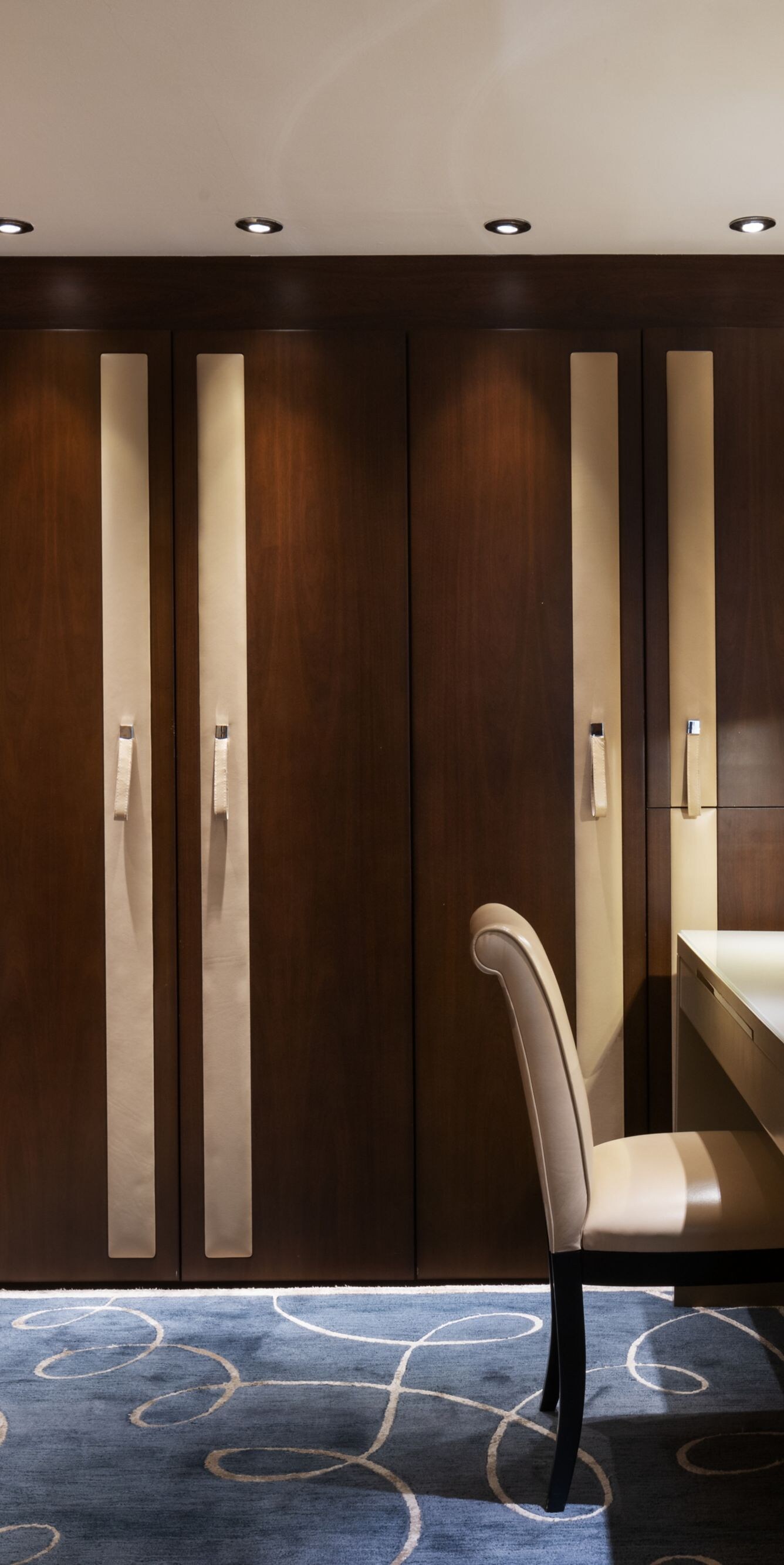 Lugal dressing room with wardrobes and vanity