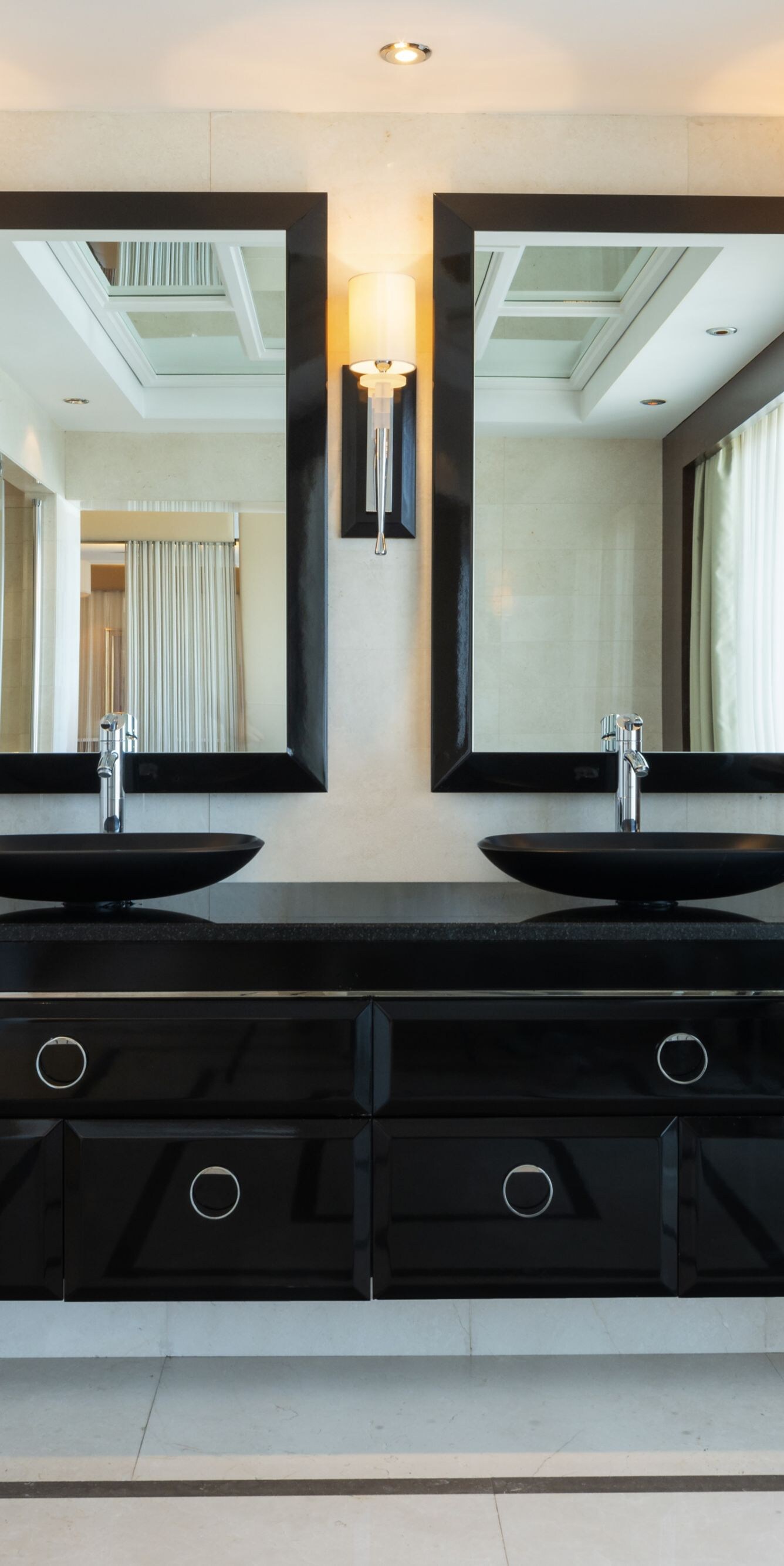 Lugal bathroom with double vanity and mirrors