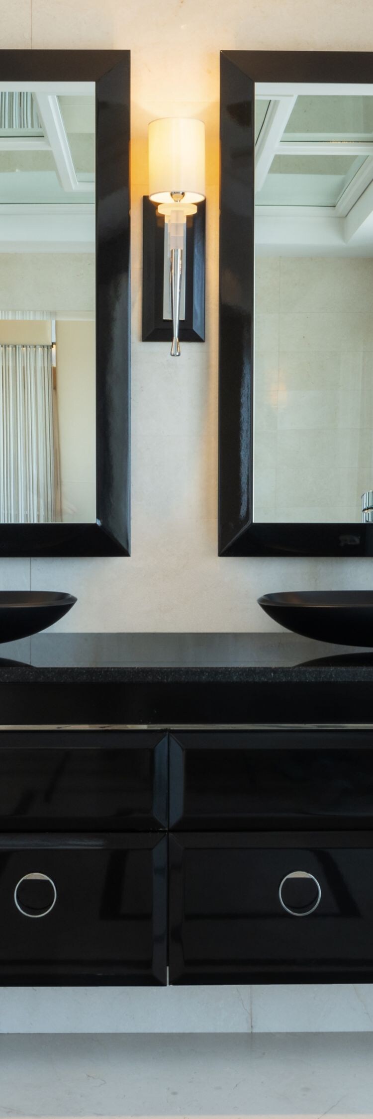 Lugal bathroom with double vanity and mirrors