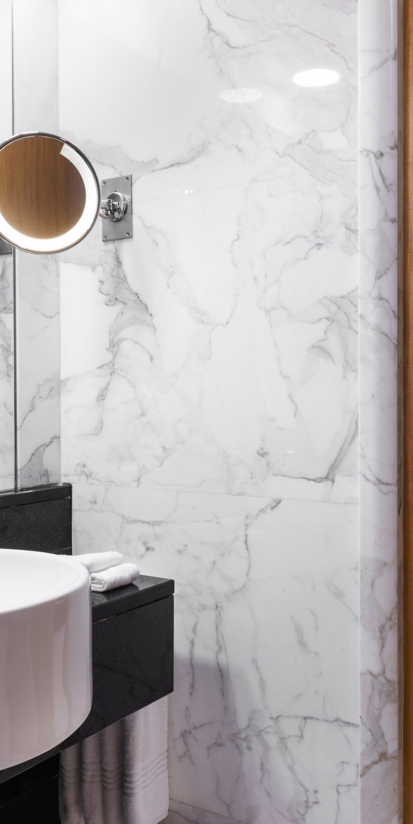 Marble bathroom with vanity, tub and shower