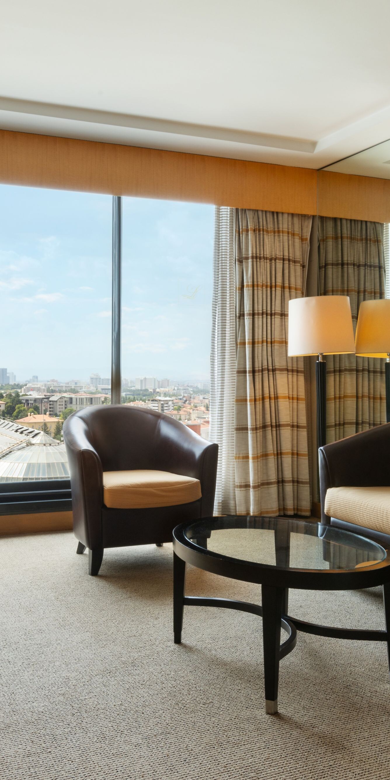 Living area with sofa and panoramic city view