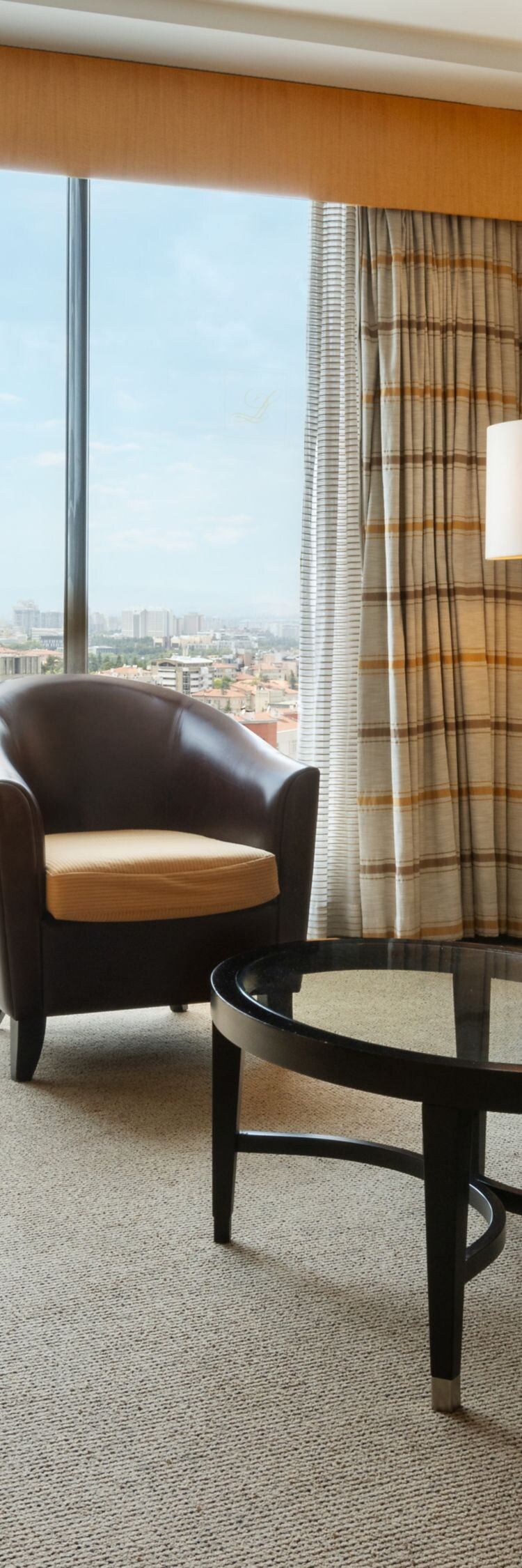 Living area with sofa and panoramic city view