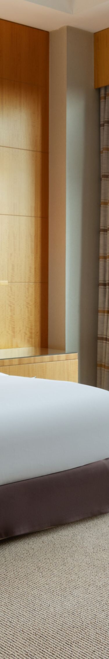Two Bedroom Suite king bed with large windows