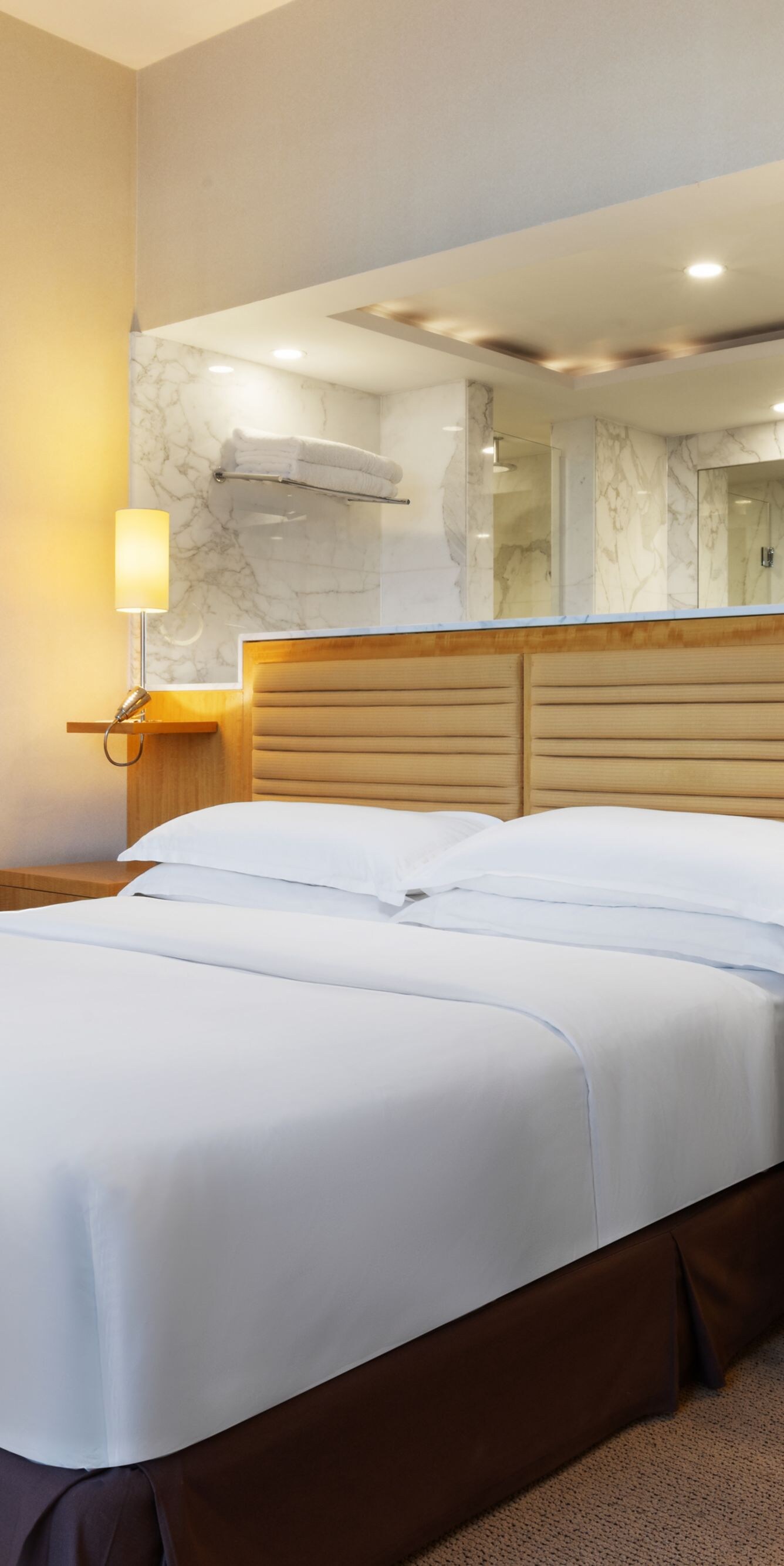 Two Bedroom Suite king bed with marble bathroom