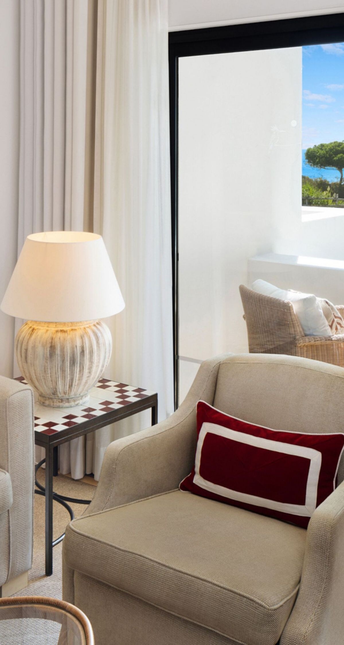 living room with balcony view of sea