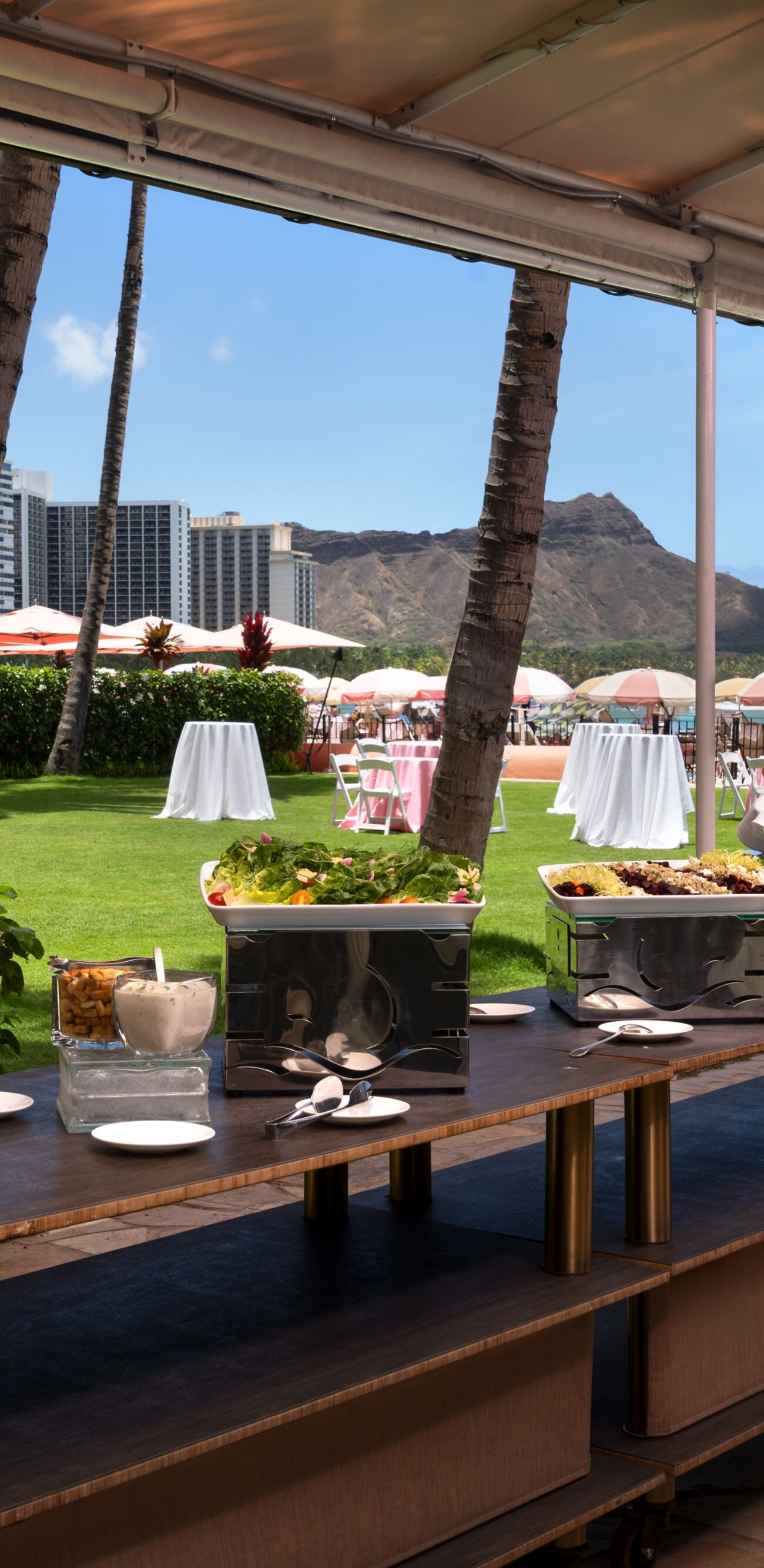 Outdoor buffet set on the oceanfront lawn at The R