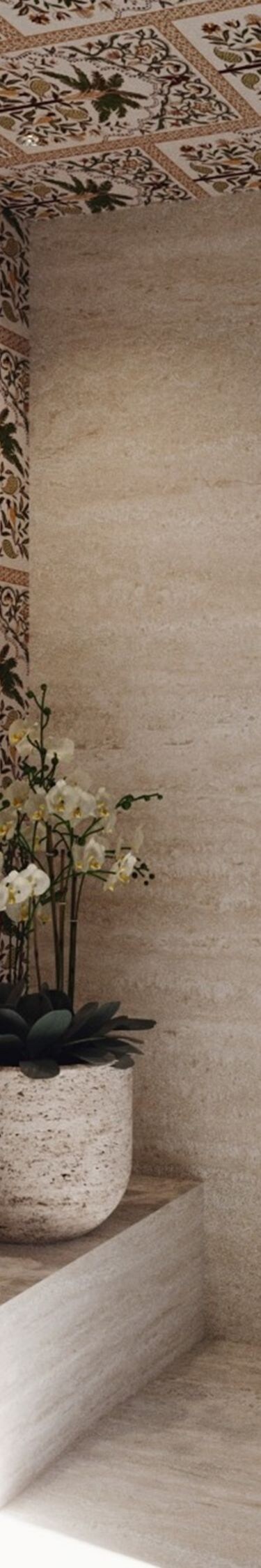 Baño decorativo con lavamanos sobre encimera de piedra