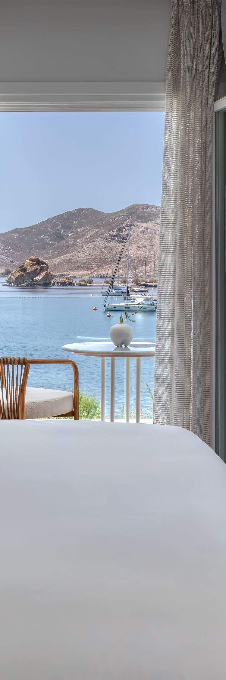 Bedroom with king size bed & views of the Aegean