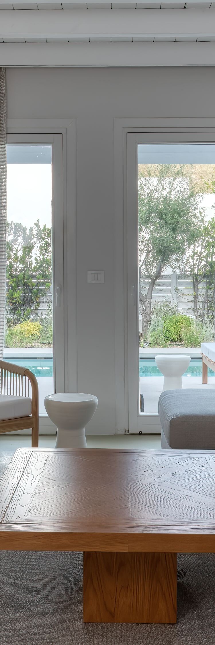 Living room with pool views  